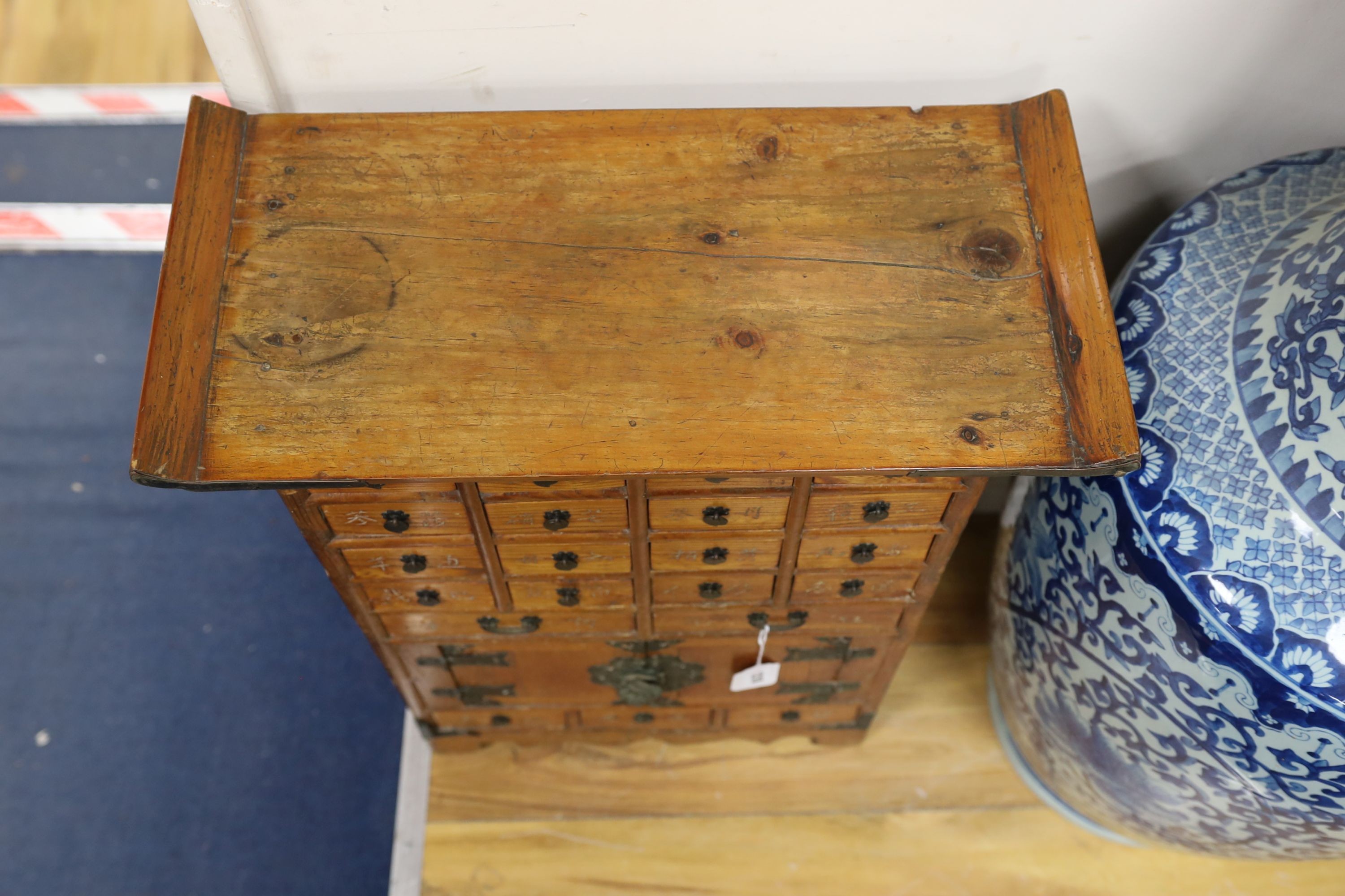 A small Chinese elm medicine chest, width 50cm, depth 24cm, height 66cm